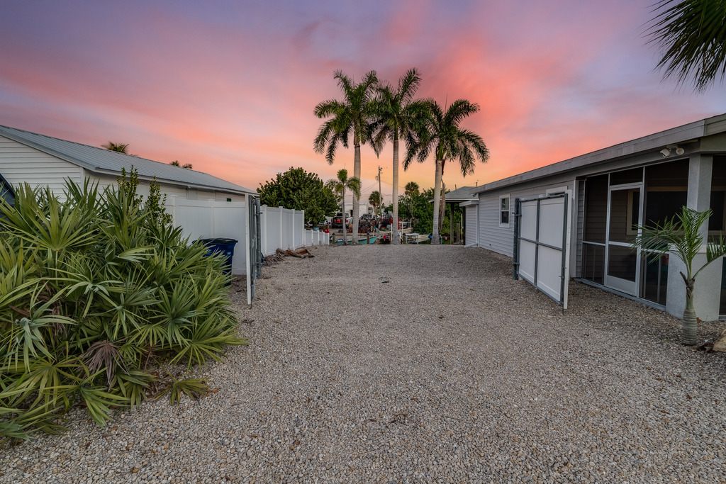 Twilight exterior photo of a waterfront property in Matlacha, Florida